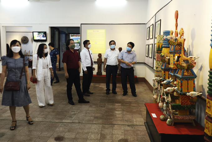 Visitors contemplating exhibits