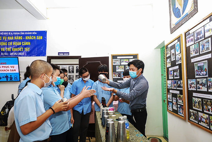 Students learning bartending skills