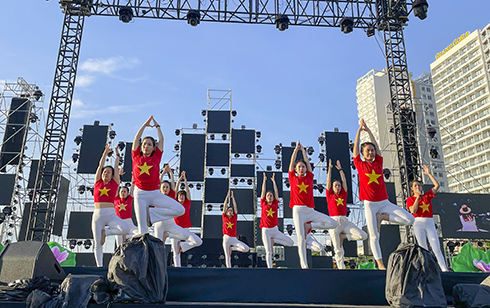 Over 100 people join mass yoga session