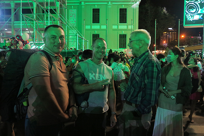 Russian tourists enjoying festive atmosphere at 2-4 Square