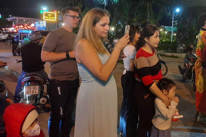 Foreign tourists taking photos on New Year’s Eve