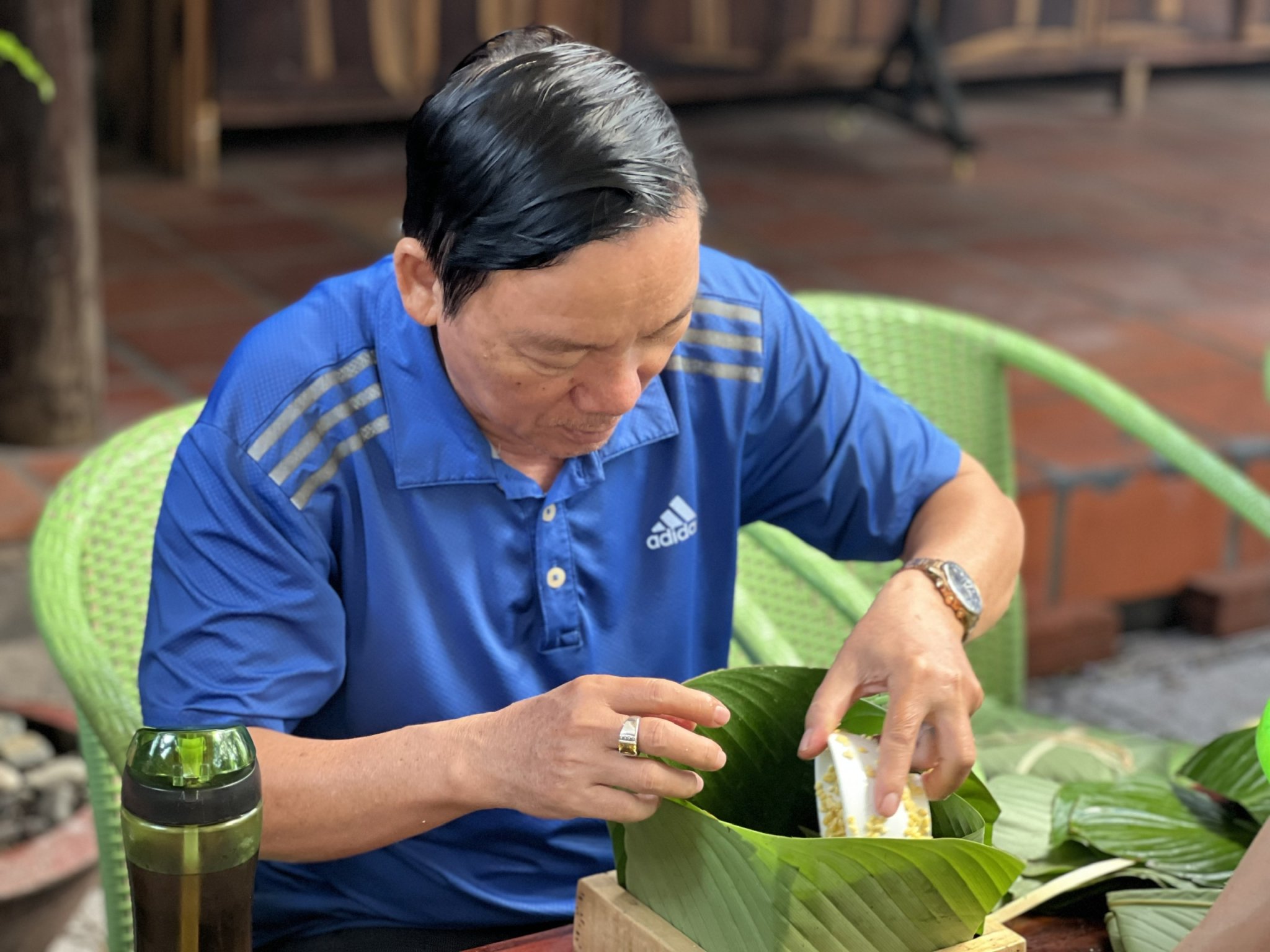 Putting leaves into a wooden mold 