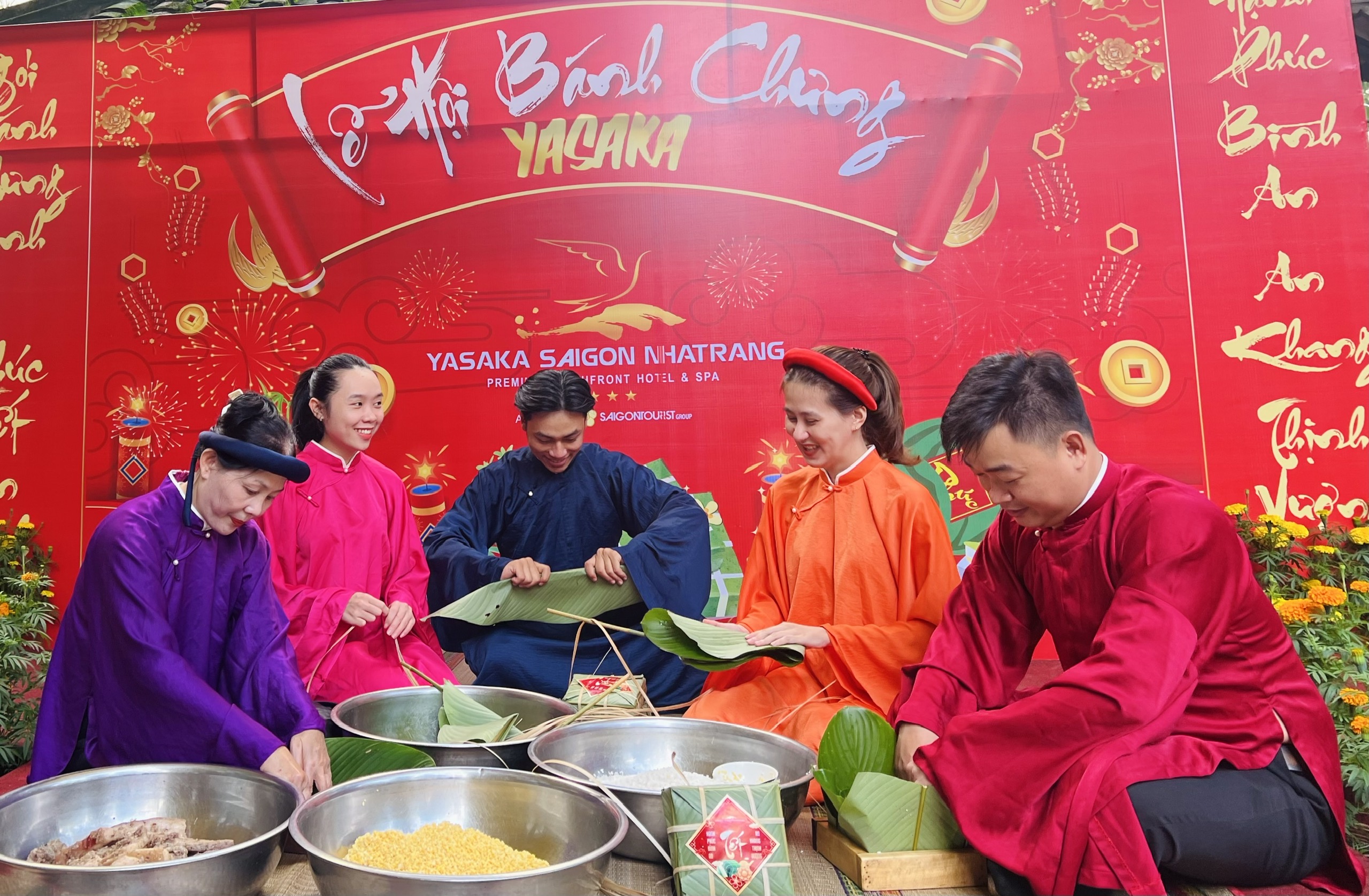 People wearing Vietnam’s traditional costume making “banh chung” 