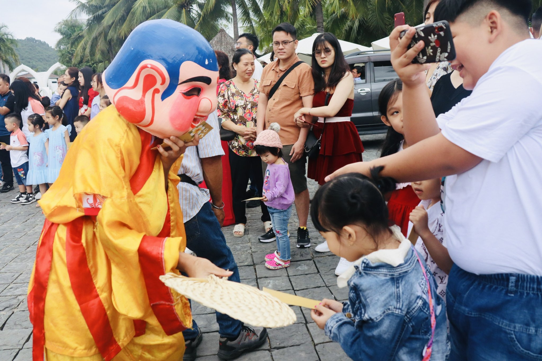 God of Wealth offering lucky money to children