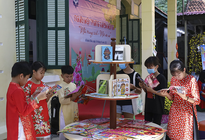 Children reading book at the book festival for children 